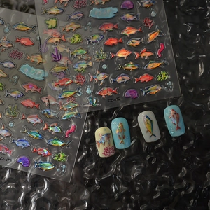 Holographic colorful ocean fish nail stickers with embossed coral designs on black background