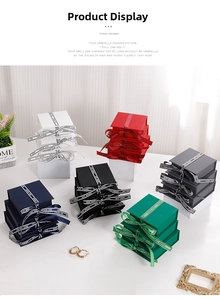 Close-up of multi-color jewelry boxes with Best Wishes ribbons in a lifestyle set