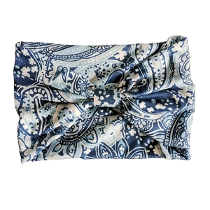 Close-up of blue and white paisley yoga headband made of soft stretch cotton fabric