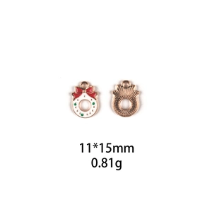 Detail of Christmas snowman alloy pendant showing 11x15mm size and 0.81g weight measurements