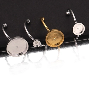 Macro shot of silver and gold stainless steel round bezel settings for DIY jewelry making