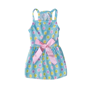Polka dot pet dress detail featuring a large pink silk bow and vibrant multi-colored dots
