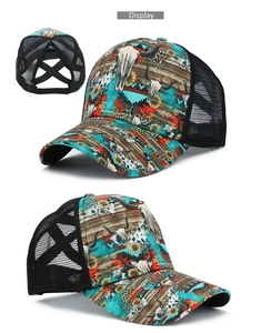 Detail view of printed baseball cap with bohemian sunflower pattern and ponytail hole