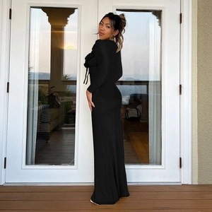 Detailed full-length view of the black slim-fit ruffle dress with elegant floor length