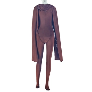 Detail of brown bodycon jumpsuit with matching long cape and ruching texture