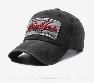 Detail of vintage washed charcoal baseball cap with New York 3D embroidery and cloth label