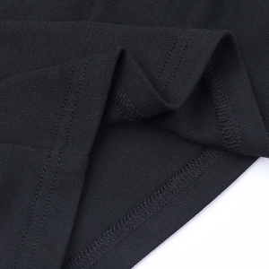 Macro view showing high-quality black knitted fabric texture with double stitching detail