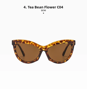 Detail view of cat eye sunglasses featuring demi tortoise shell frames and brown lenses