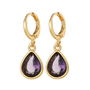 Elegant gold drop earrings with purple pear-shaped faceted gemstones on white background