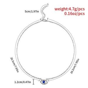 Detailed view of evil eye necklace pendant with blue stone and dimension markings