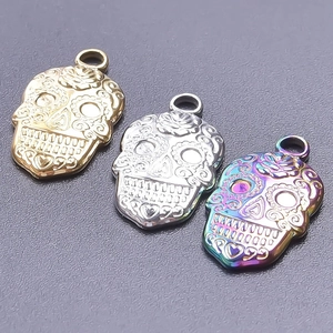 Detailed view of skull pendants in gold, silver and iridescent finishes for DIY jewelry