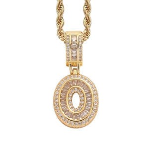 Detail of hip-hop O-letter pendant with square zircons on golden rope chain