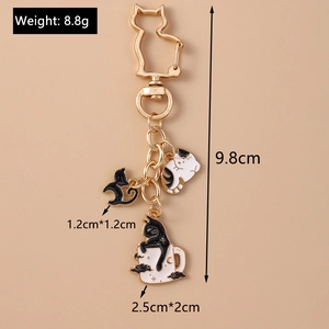 Detailed size chart showing cute enamel cat charms and heart-shaped gold metal keychain