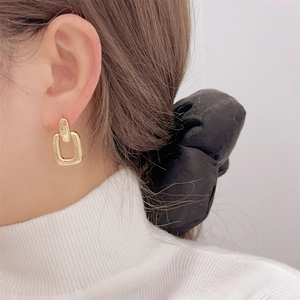 Minimalist gold geometric rectangular earrings for women with a sleek french style