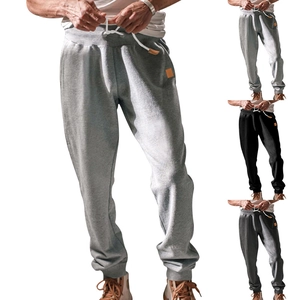 Casual drawstring joggers for men in grey and black with elasticated cuffs and side patch