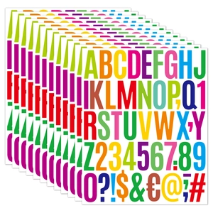 Close-up of stacked colorful 2-inch alphabet and number stickers for journals