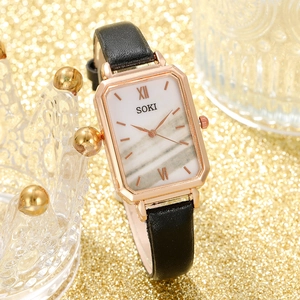 Vintage rectangular women's watch with rose gold case, marble dial, and black leather strap