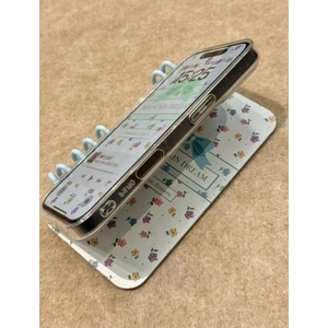Floral bow book style phone case for iPhone 15 Pro with romantic mountain dream design