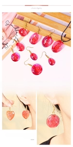 DIY glitter resin earrings in heart and teardrop shapes made from silicone molds