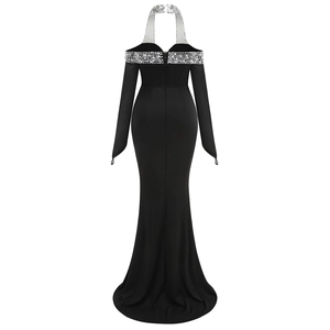 Detail of sequined halter neckline and dark mermaid evening gown cut in black