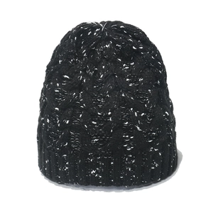 Winter chunky cable knit beanie with black and white snowflake pattern textures
