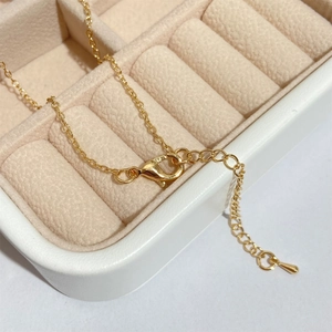 Gold-plated vintage Lovers Tarot necklace featuring a sturdy lobster clasp and chain detail