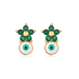 Detail of star-shaped zircon earrings with blue evil eye enamel charms in gold finish