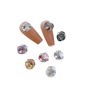 Luxe multi-faceted nail rhinestones in assorted colors with silver micro-pave borders