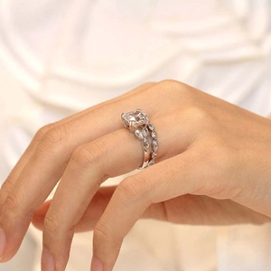 Close-up of a luxury bridal ring set with a princess cut main diamond and marquise band