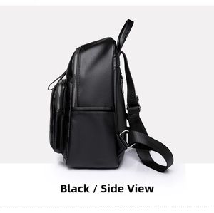 Detail view of the black leather backpack side profile with silver zipper and texture