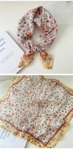 Close-up of lightweight floral cotton linen scarf with soft pink and blue flower patterns