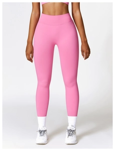 Close-up of pink high-waisted seamless yoga pants featuring tummy control and elastic fabric