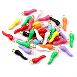 Colorful chili pepper charms in various enamel colors with golden metal rings on white base