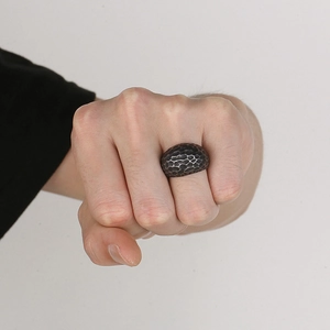 Men's retro hammered titanium steel ring with oxidized black finish on model's hand