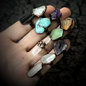 Set of 11 vintage adjustable copper rings with assorted natural raw gemstones and crystals