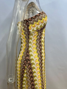 Detail of colorful zigzag crochet knit pattern and slim fit design on beach dress