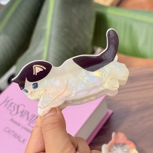 Chic cat shaped acetate hair claw clip with iridescent white and purple patterns