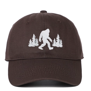Detailed view of the embroidered Bigfoot silhouette on a vintage brown cotton baseball cap
