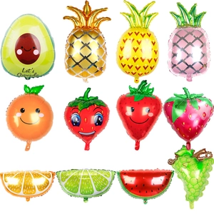 Detailed assortment of colorful fruit-shaped foil balloons including avocado and pineapple