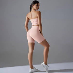 Pink two-piece yoga set with strapless top and high-waist scrunch shorts for fitness