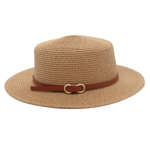 Close-up of beige straw boater hat featuring a brown leather belt with gold buckles