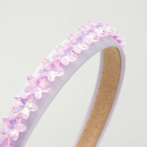 Elegante cerchietto viola con stelle di cristallo scintillanti e raso morbido