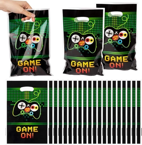 Detail of level up game themed black plastic gift bags with green pixel controller prints