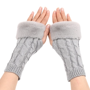 Gray knitted fingerless gloves with faux fur cuffs showing winter warm arm sleeves