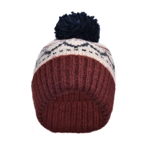Vue détaillée du bonnet en maille jacquard vintage avec pompon bleu marine doux.