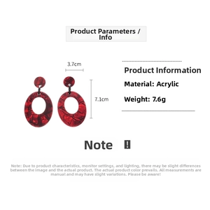 Detail view of red marble acrylic oval earrings with dimensions 7.1cm height and 3.7cm width