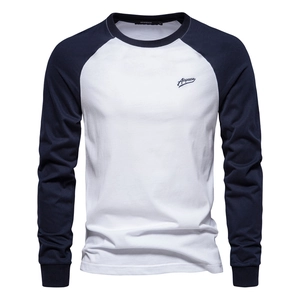 Detail of contrast raglan sleeve stitching and embroidered logo on long sleeve T-shirt