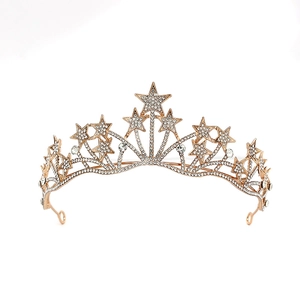 Detailed view of the golden star-shaped bridal crown with sparkling white rhinestones