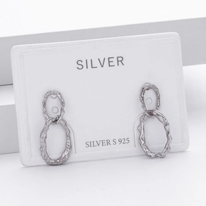 Detail of S925 sterling silver earrings with double ring hammered metal design