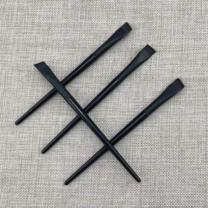 Set of four professional angled flat head makeup brushes with sleek black handles on linen